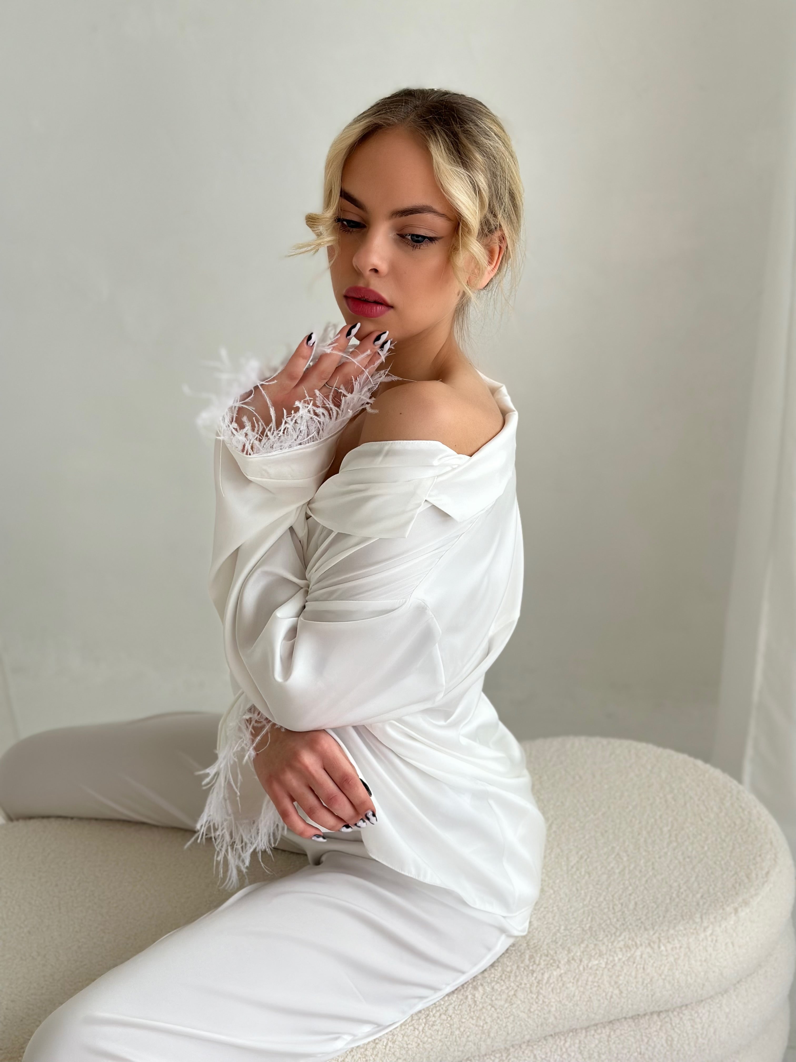 White pajamas with pants and feathers