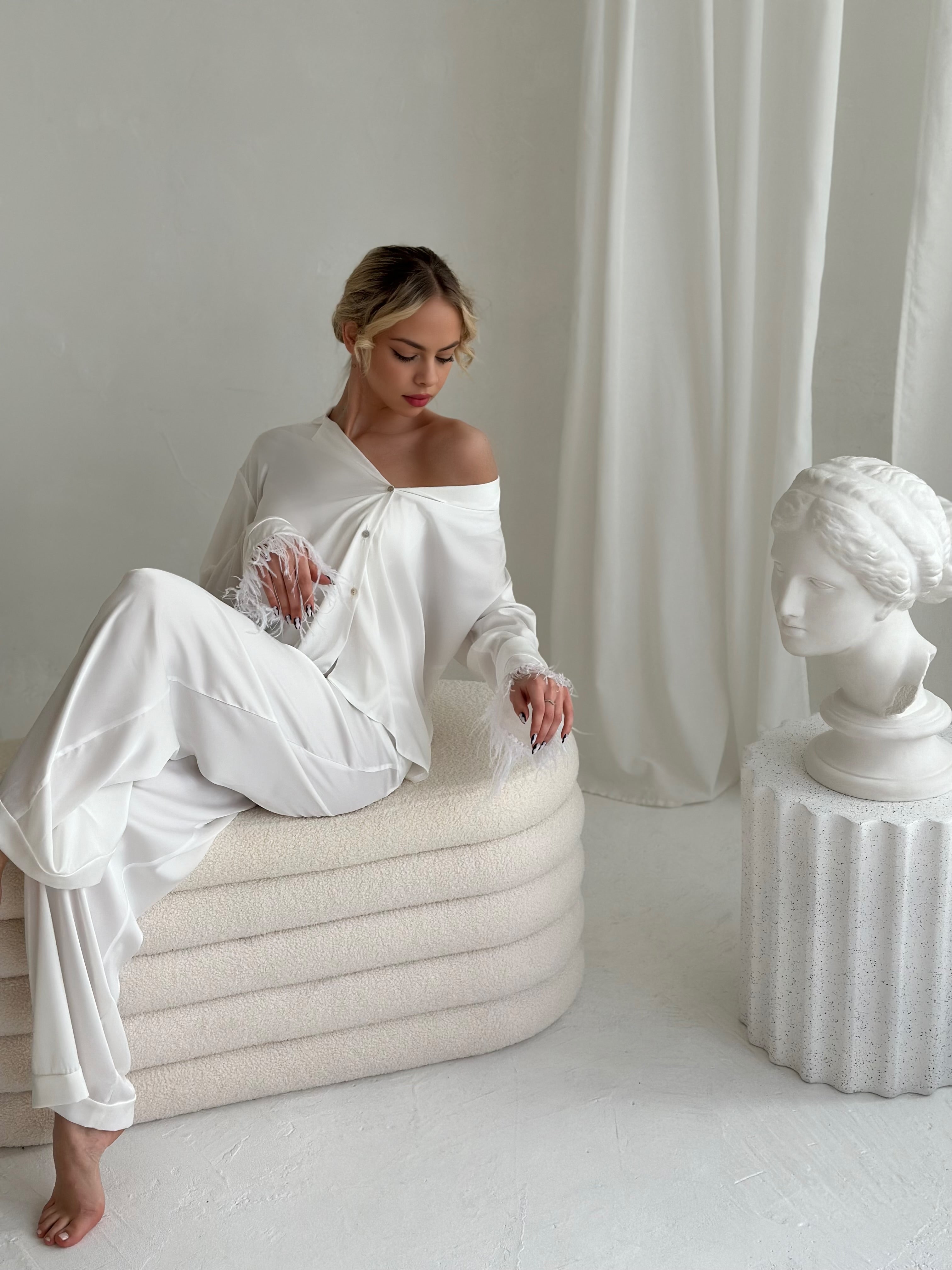 White pajamas with pants and feathers